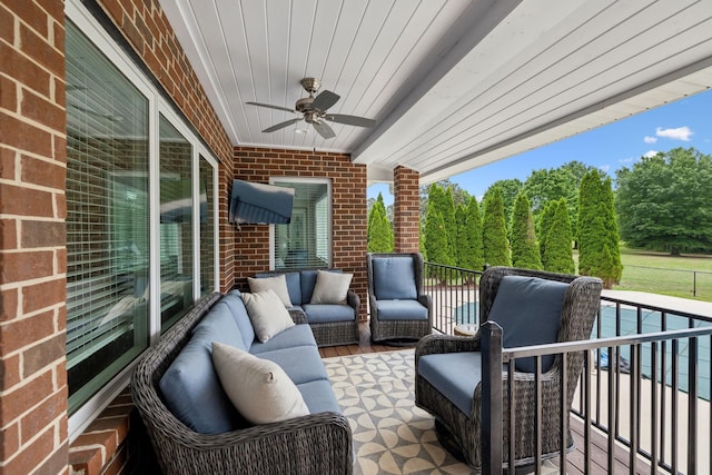 view of patio / terrace featuring a ceiling fan, a balcony, and an outdoor hangout area