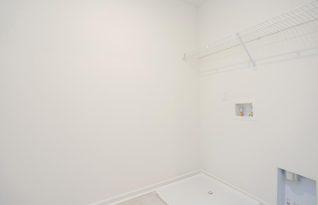 laundry room featuring laundry area, baseboards, and hookup for a washing machine