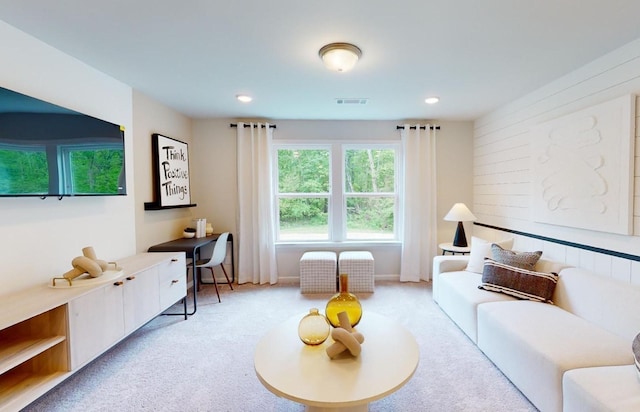 carpeted living area featuring recessed lighting and visible vents