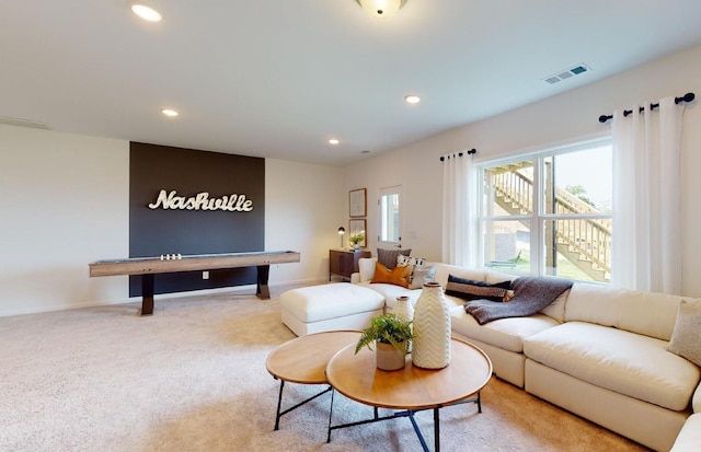 living area featuring visible vents, recessed lighting, baseboards, and carpet floors