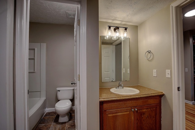 full bathroom with vanity, toilet, a textured ceiling, and visible vents