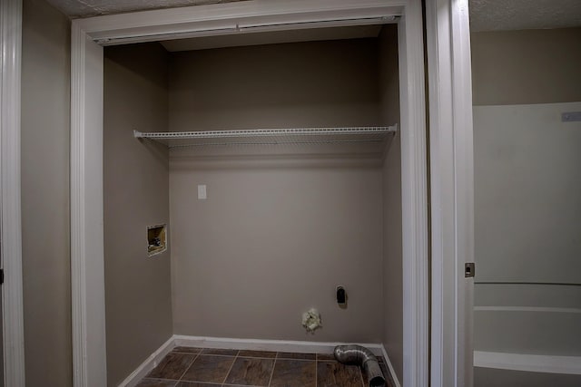 washroom featuring laundry area, baseboards, and hookup for a washing machine