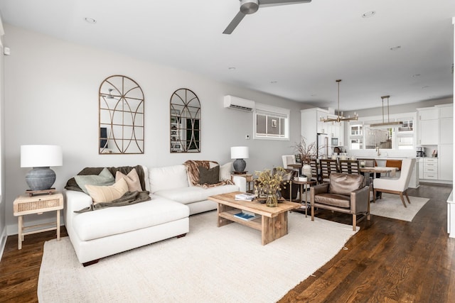 3116 Trevor St, Nashville, TN 37209 - living area with a wall unit AC, ceiling fan with notable chandelier, and dark wood-type flooring