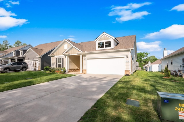 view of front of home with board and batten siding, a front yard, concrete driveway, a shingled roof, and stone siding