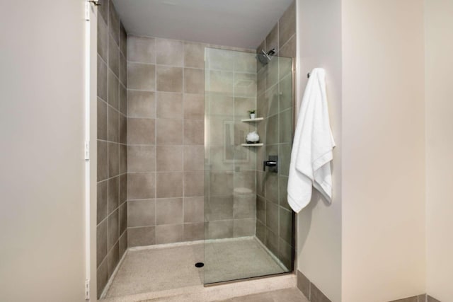 bathroom with tiled shower