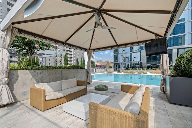 pool with a gazebo, a patio area, and outdoor lounge area