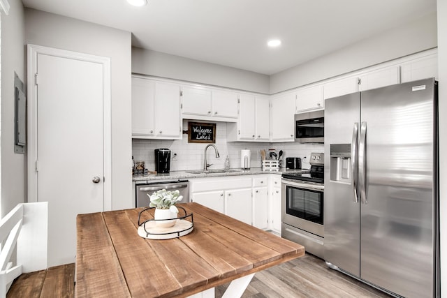 250 Sanders Ferry Rd Unit 4, Hendersonville, TN 37075 - kitchen featuring stainless steel appliances, recessed lighting, white cabinetry, and a sink