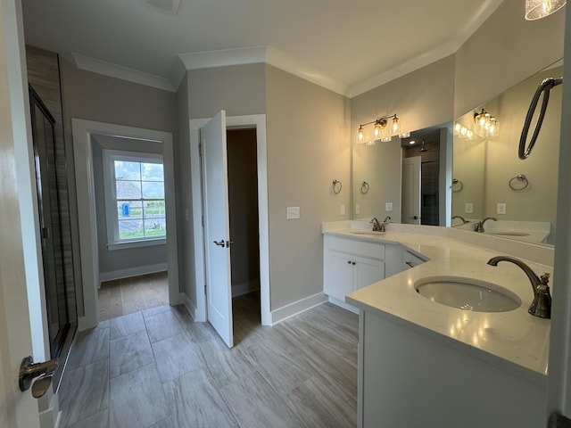 bathroom featuring crown molding, a sink, baseboards, and double vanity