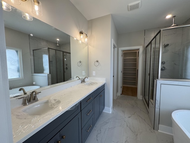 full bath featuring visible vents, marble finish floor, a bathtub, a sink, and a stall shower