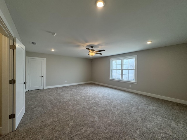 spare room featuring ceiling fan, visible vents, baseboards, carpet, and recessed lighting