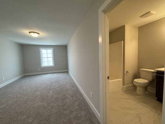 bathroom featuring vanity, toilet, marble finish floor, baseboards, and visible vents
