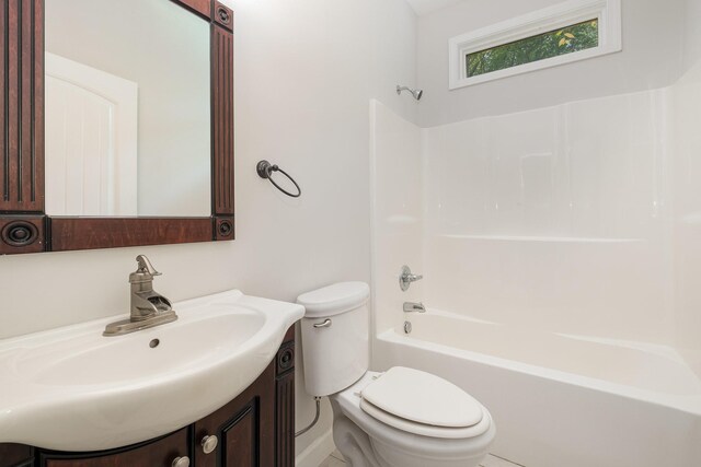 full bathroom with vanity, bathtub / shower combination, and toilet