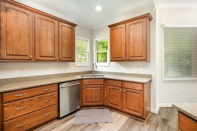 kitchen featuring crown molding, stainless steel dishwasher, brown cabinets, a sink, and light wood-style floors