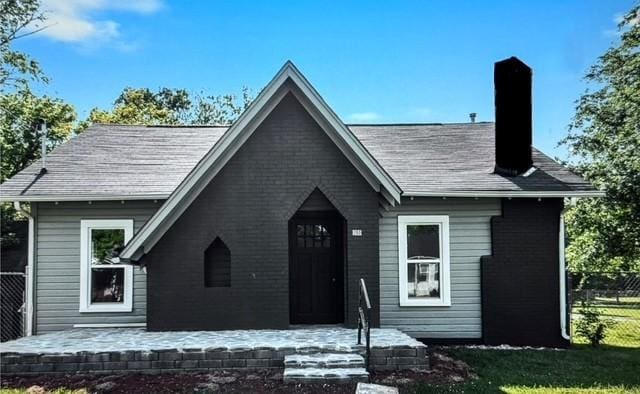 200 Tucker St, Decherd, TN 37324 - view of front of house with a chimney and brick siding