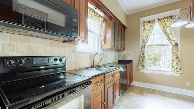 706 N Church St, Murfreesboro, TN 37130 - kitchen featuring black microwave, electric range oven, stainless steel dishwasher, a sink, and baseboards