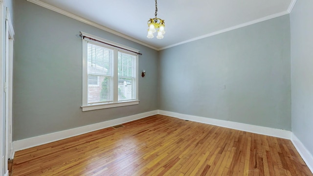 706 N Church St, Murfreesboro, TN 37130 - unfurnished room with visible vents, ornamental molding, baseboards, light wood finished floors, and a notable chandelier