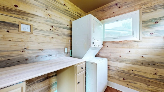 706 N Church St, Murfreesboro, TN 37130 - washroom featuring wooden walls, stacked washer / drying machine, and cabinet space