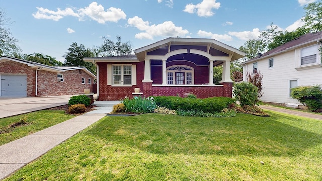 706 N Church St, Murfreesboro, TN 37130 - view of front of house featuring brick siding, a garage, driveway, and a front lawn