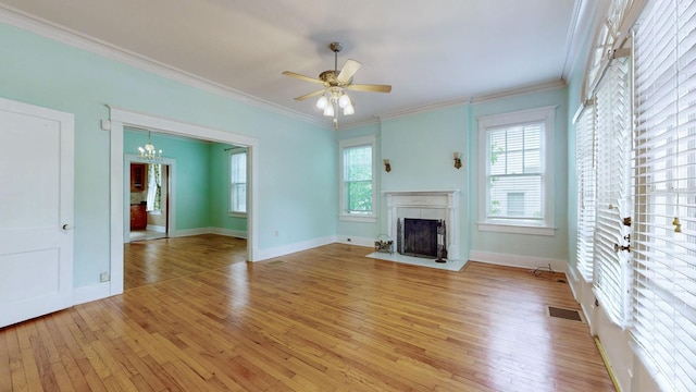 706 N Church St, Murfreesboro, TN 37130 - unfurnished living room featuring visible vents, ornamental molding, light wood-style flooring, and a fireplace with flush hearth