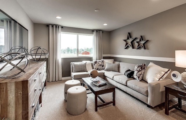 living area with baseboards, light carpet, and recessed lighting