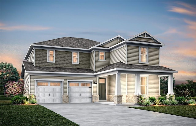 view of front of house featuring an attached garage, driveway, and stone siding