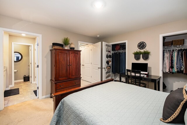 156 Cecil Rd, Lebanon, TN 37087 - bedroom with light colored carpet, multiple closets, and baseboards