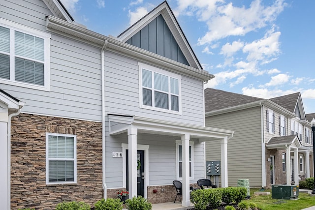 156 Cecil Rd, Lebanon, TN 37087 - view of front of house with board and batten siding, stone siding, and central air condition unit