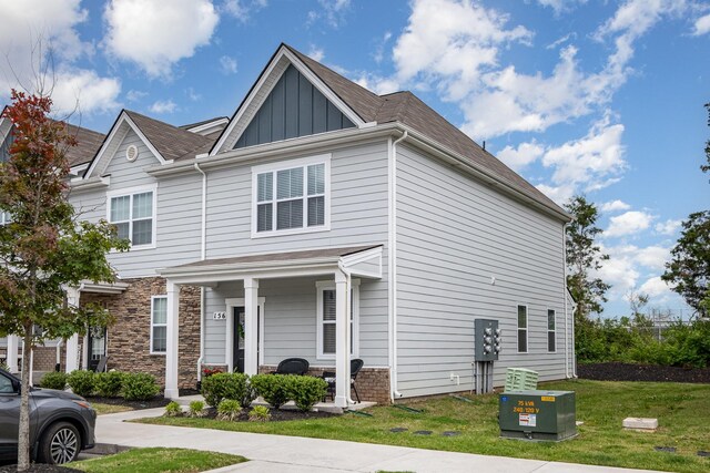 156 Cecil Rd, Lebanon, TN 37087 - townhome / multi-family property with a porch, a front yard, board and batten siding, and stone siding