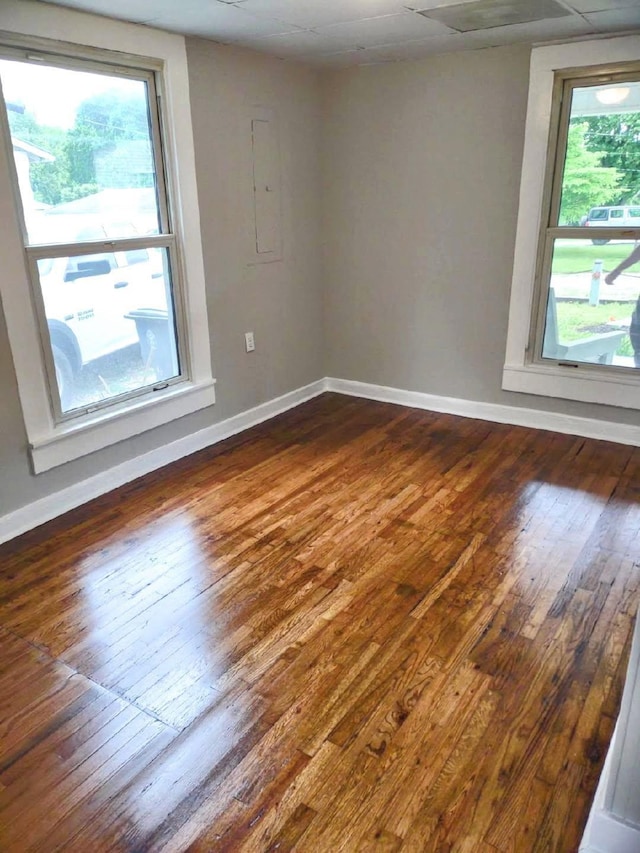 121 Swann St, Mcminnville, TN 37110 - unfurnished room with dark wood-type flooring, baseboards, and a wealth of natural light