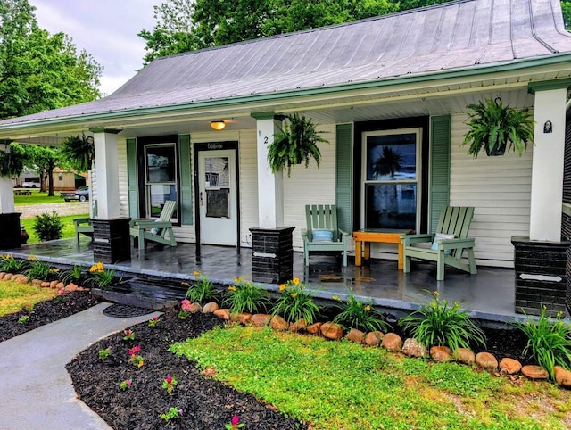 121 Swann St, Mcminnville, TN 37110 - view of front of house featuring covered porch and metal roof
