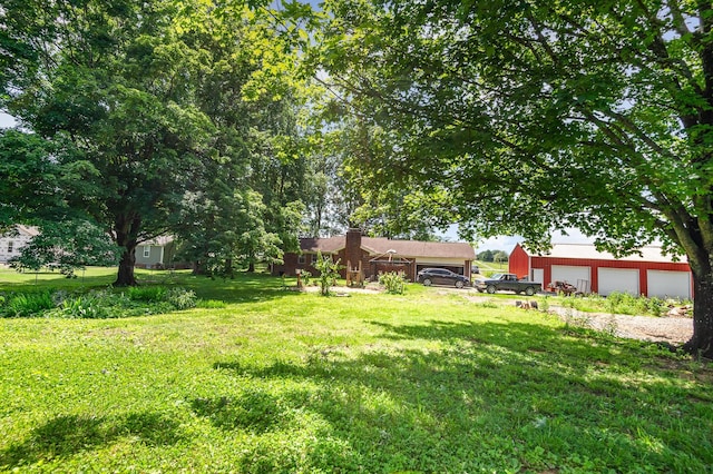 270 Greenfield Ln, Castalian Springs, TN 37031 - view of green lawn featuring a garage