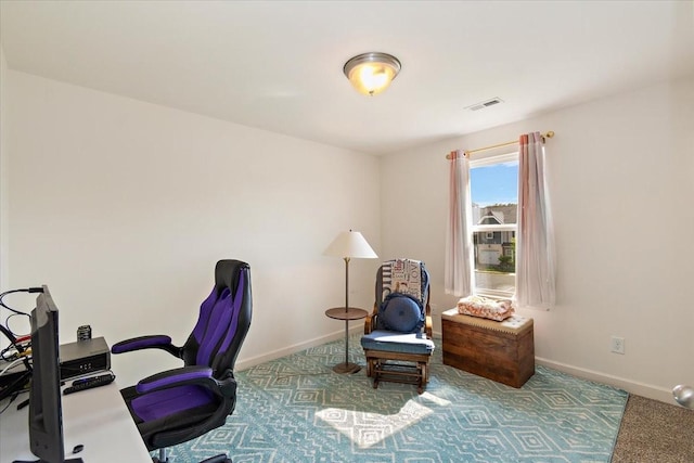 office with visible vents, carpet flooring, and baseboards