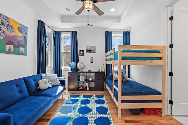 1811 Meridian St, Nashville, TN 37207 - bedroom featuring visible vents, a ceiling fan, a raised ceiling, and wood finished floors