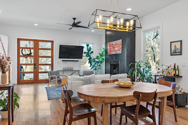 1811 Meridian St, Nashville, TN 37207 - dining area with recessed lighting, a large fireplace, wood finished floors, and ceiling fan with notable chandelier