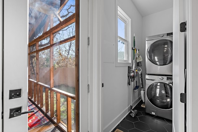 1811 Meridian St, Nashville, TN 37207 - laundry room with laundry area, baseboards, stacked washer / dryer, and dark tile patterned flooring