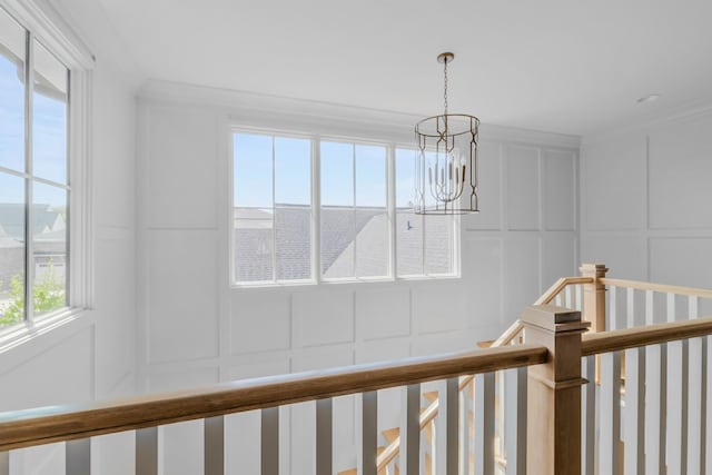 details with a chandelier and a decorative wall
