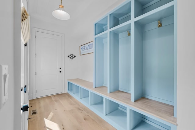 mudroom with visible vents and light wood finished floors