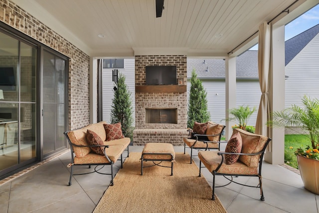 sunroom / solarium with concrete floors and brick wall