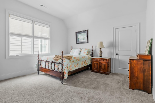 bedroom featuring light carpet and visible vents