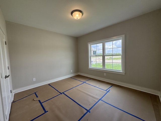 empty room with baseboards
