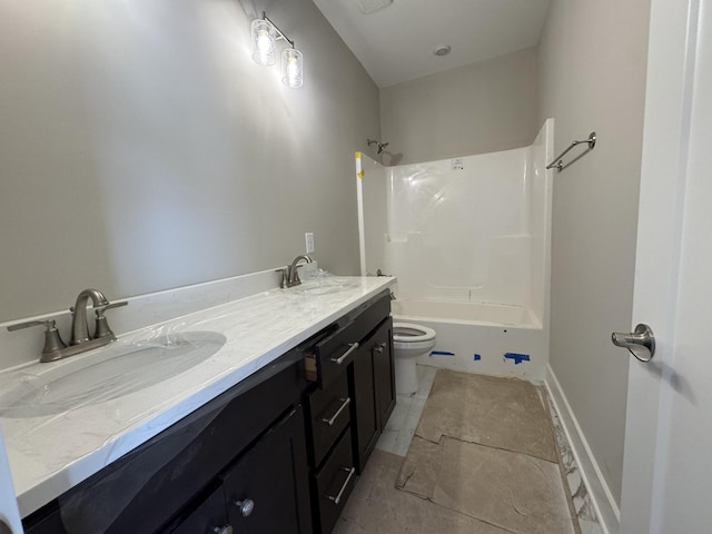 full bath with  shower combination, a sink, double vanity, and toilet