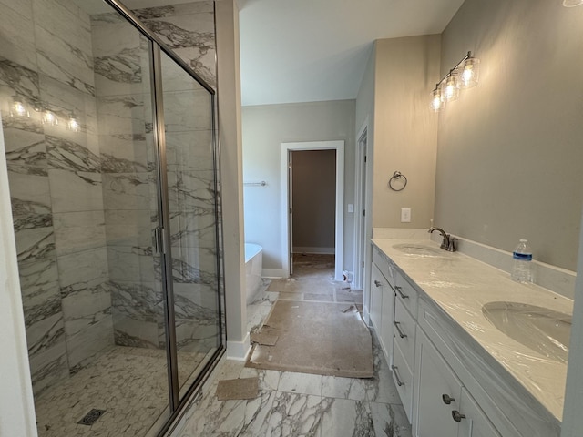 bathroom featuring a sink, a marble finish shower, and a soaking tub
