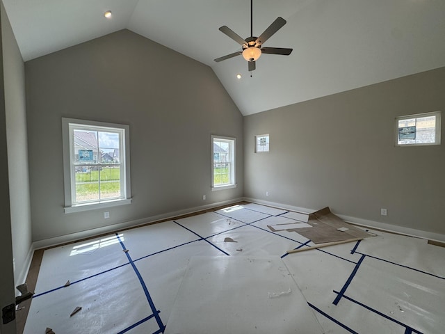 unfurnished bedroom with high vaulted ceiling, multiple windows, baseboards, and recessed lighting