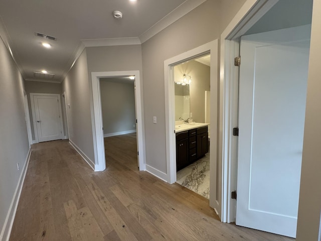 4020 Runyan Cv, Murfreesboro, TN 37127 - hall with crown molding, light wood-style flooring, a sink, and baseboards
