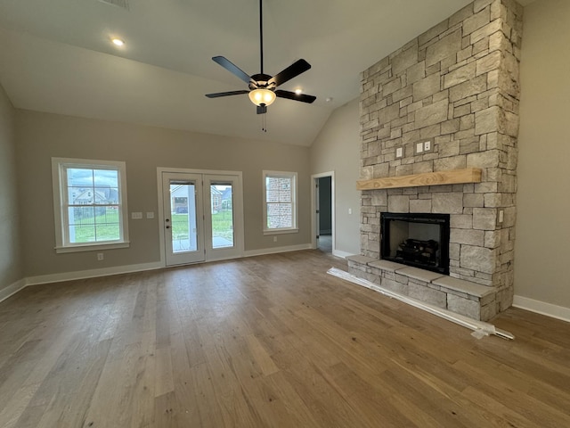 4020 Runyan Cv, Murfreesboro, TN 37127 - unfurnished living room with baseboards, wood finished floors, a fireplace, ceiling fan, and vaulted ceiling