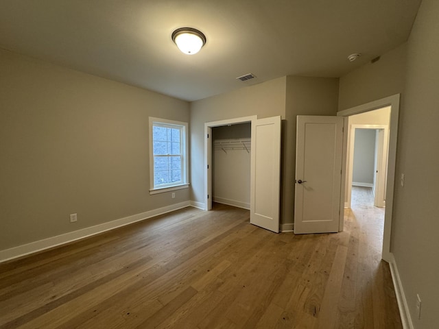 4020 Runyan Cv, Murfreesboro, TN 37127 - unfurnished bedroom with wood finished floors, baseboards, and a closet