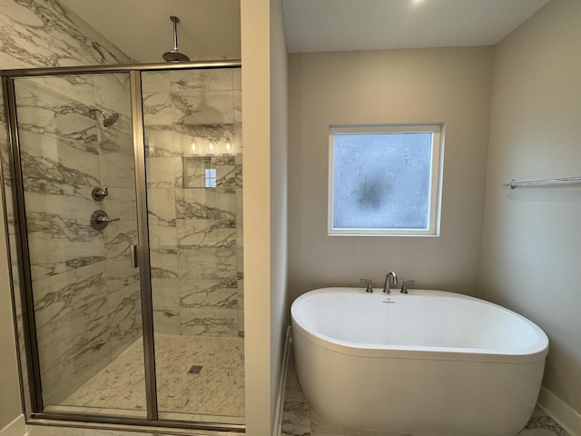 4020 Runyan Cv, Murfreesboro, TN 37127 - bathroom featuring marble look tile flooring, a freestanding bath, a stall shower, and baseboards