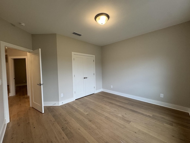4020 Runyan Cv, Murfreesboro, TN 37127 - unfurnished bedroom featuring wood finished floors, baseboards, and a closet
