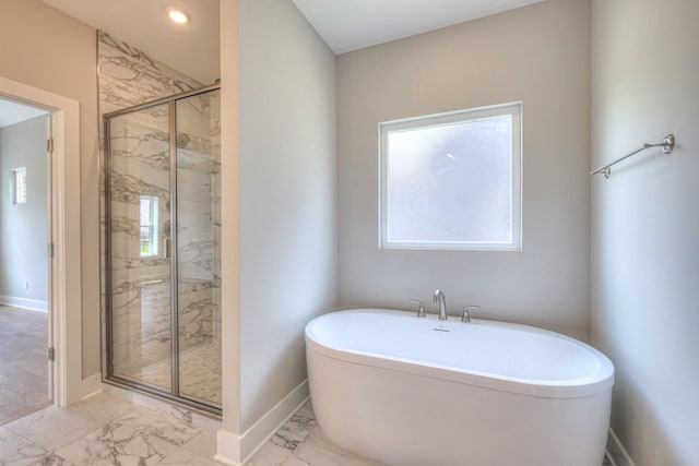 4020 Runyan Cv, Murfreesboro, TN 37127 - bathroom featuring marble finish floors, a freestanding bath, and a marble finish shower
