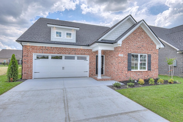 4020 Runyan Cv, Murfreesboro, TN 37127 - view of front facade with brick siding, concrete driveway, a front yard, and roof with shingles
